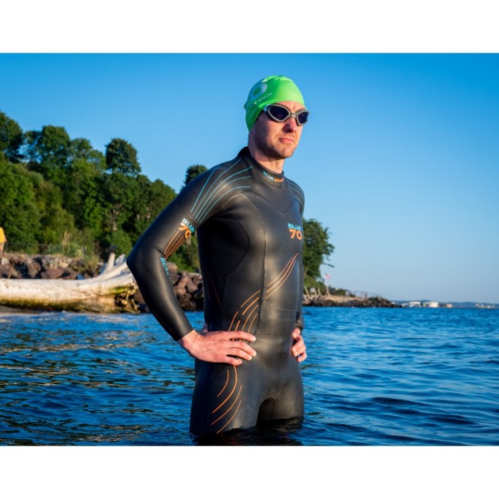 man wearing reaction wetsuit stood in lake