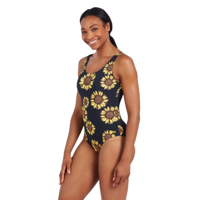 Lady wearing Zoggs Rise & Shine Sunflower open water swimming costume side view