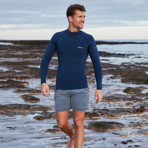 man on beach wearing Zone3 Yulex Mens Long-sleeve thermal top